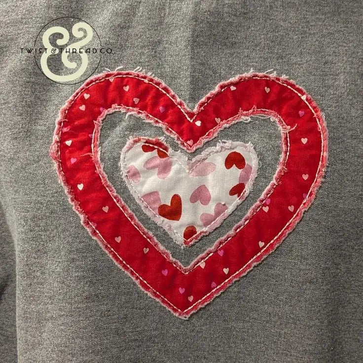 Red and white heart applique embroidery on grey fabric by Twist & Thread Co.