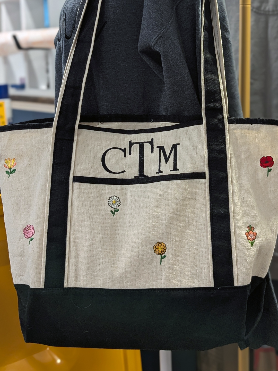 Custom cheer bag tag with purple ribbons, embroidered name, and ELITE text by Twist & Thread Co.