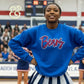 Cheerleader in blue Bears embroidered sweatshirt by Twist & Thread Co. at sports event