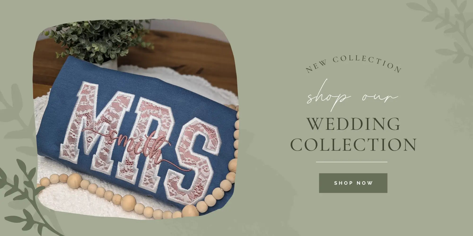 Blue embroidered ’mrs’ pillow with lace detailing and wooden bead trim.