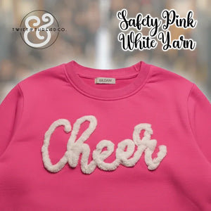 Bright pink Gildan sweatshirt with Cheer in white yarn, Twist & Thread Co. branding