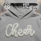 Gray Gildan hoodie with white yarn 'Cheer' text, Ash White Yarn by Twist & Thread Co.