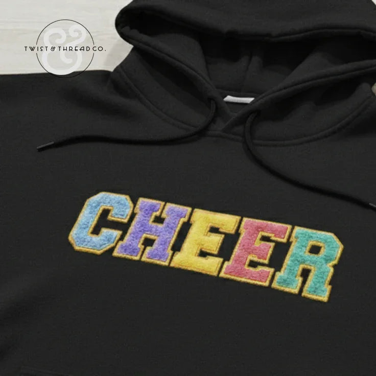 Black hoodie with colorful varsity CHEER embroidered text on front