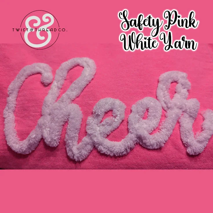 Safety pink fabric with white yarn 'Cheer' embroidery, Twist & Thread Co. branding