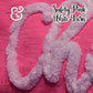 White chenille yarn script on pink fabric, Twist & Thread Co. logo, safety pink yarn.