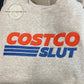 Gray custom embroidered sweatshirt with bold red and blue text, Twist & Thread Co. branding