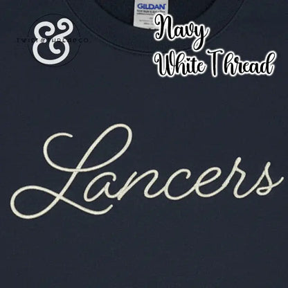 Navy blue Gildan shirt with white embroidered 'Lancers' script and Twist & Thread Co logo