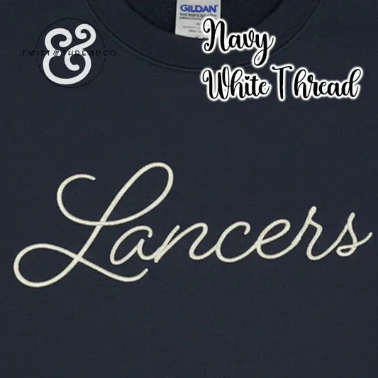 Navy blue Gildan shirt with white embroidered 'Lancers' script and Twist & Thread Co logo