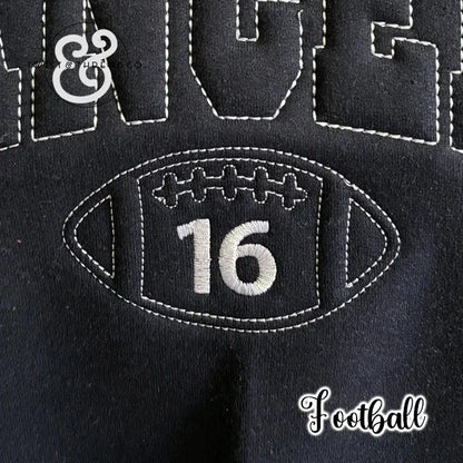 Black fabric with white stitched football design and number 16, sports sweatshirt detail