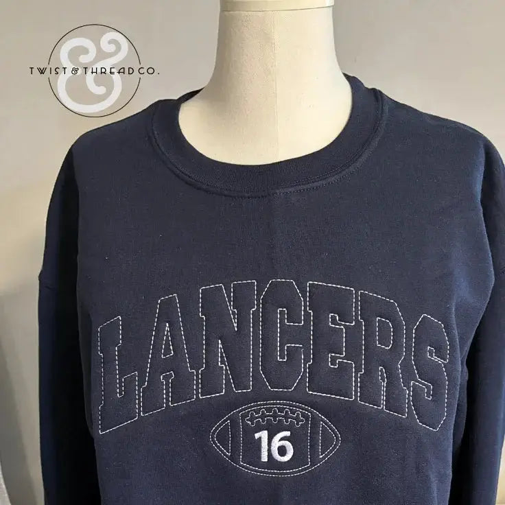 Navy blue sweatshirt with stitched 'LANCERS' text and football graphic with number 16, displayed on mannequin
