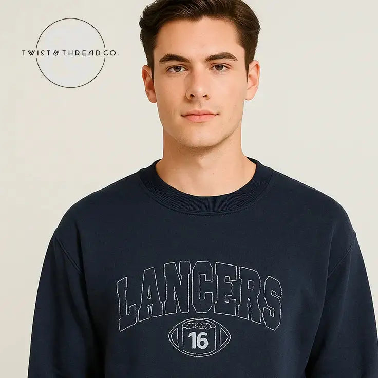 Man wearing navy blue sweatshirt with 'LANCERS' and football graphic logo, studio background