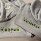 Gray pet hoodies with green embroidered names Cooper and Mulligan featuring black paw prints by Twist & Thread Co.