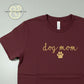 Custom embroidered Dog Mom maroon t-shirt with yellow script and paw print by Twist & Thread Co.