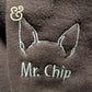 Custom dog ear embroidery with 'Mr. Chip' text on brown hoodie by Twist & Thread Co.