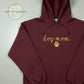 Maroon embroidered hoodie with gold 'dog mom' text and paw print, Twist & Thread Co. custom apparel