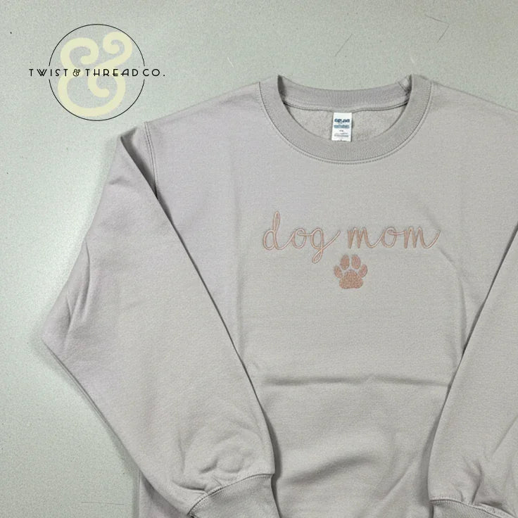 Light gray embroidered sweatshirt with 'dog mom' and paw print by Twist & Thread Co.