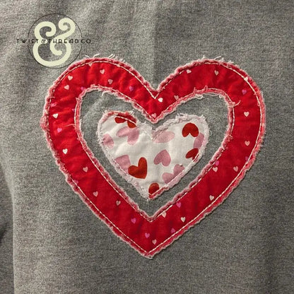 Red and white heart applique embroidery on grey fabric by Twist & Thread Co.