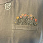 Custom embroidered wildflowers on a pocket tee by Twist & Thread Co.
