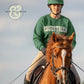 Equestrian athlete in green helmet and sweatshirt riding chestnut horse with white blaze, outdoor setting