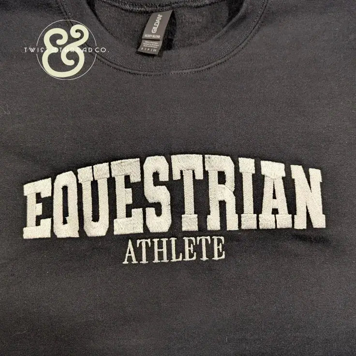 Black heavy blend sweatshirt with white embroidered text EQUESTRIAN ATHLETE by Twist & Thread Co.