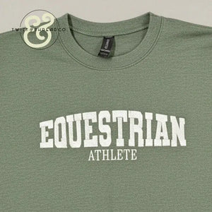 Green crewneck T-shirt with white collegiate text reading 'EQUESTRIAN ATHLETE' from Twist & Thread Co.