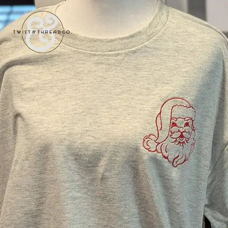 light gray sweatshirt with red embroidered vintage Santa Claus face on chest