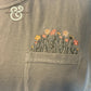 Custom embroidered wildflowers on a pocket tee by Twist & Thread Co.