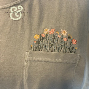 Custom embroidered wildflowers on a pocket tee by Twist & Thread Co.