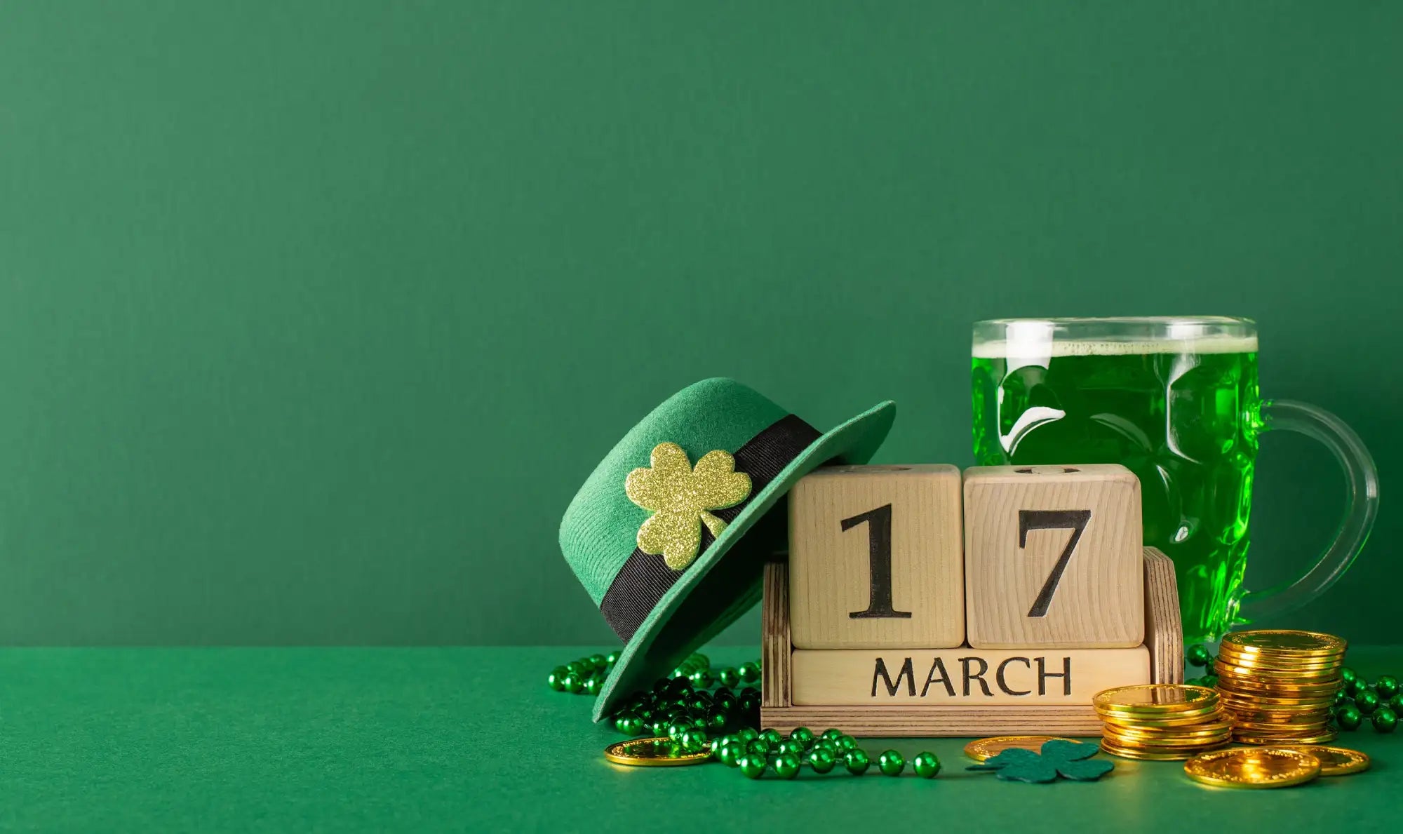 Green felt leprechaun hat with a gold shamrock emblem and black ribbon band.