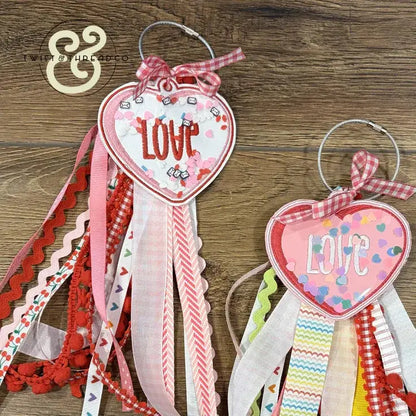 Embroidered heart-shaped LOVE ornaments with colorful ribbons and confetti, Twist & Thread Co.