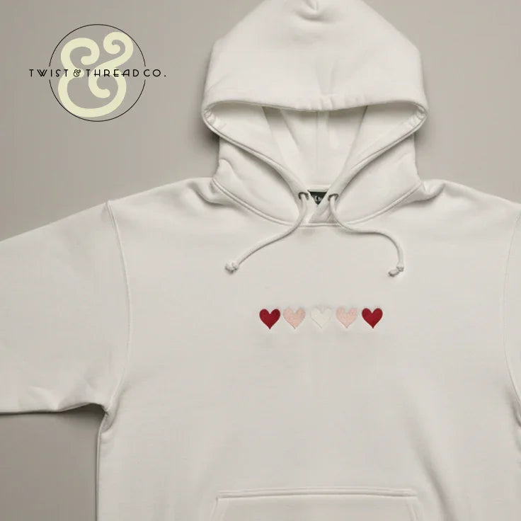 White hoodie with embroidered red and pink hearts, Twist & Thread Co. premium apparel