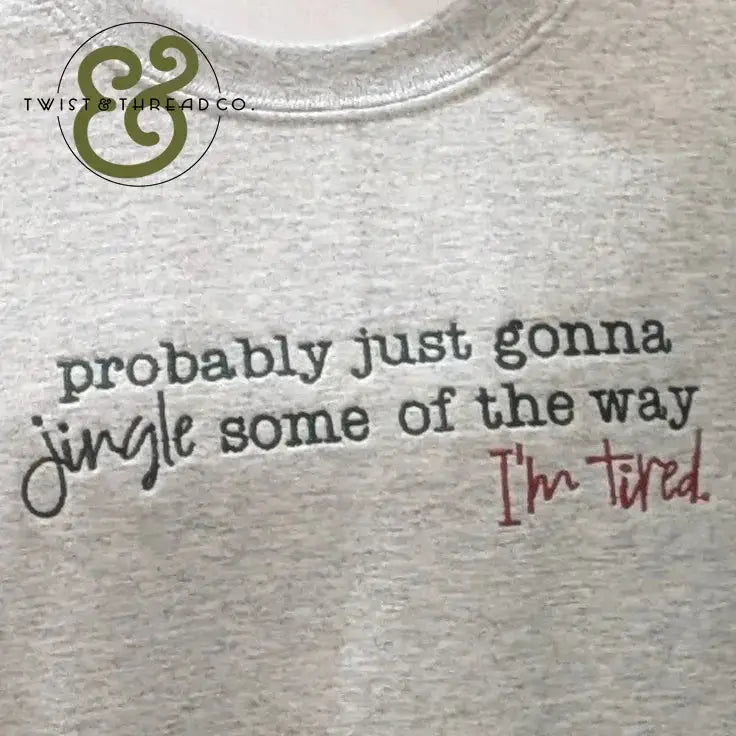 Gray shirt with the phrase "probably just gonna jingle some of the way I'm tired" printed in black and red text