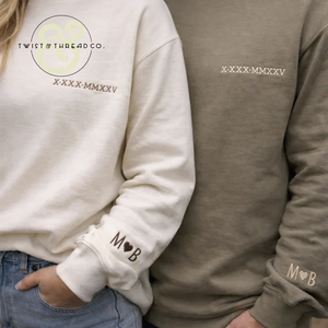 Couple wearing personalized embroidered sweatshirts by Twist & Thread Co. with custom initials