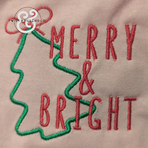 Embroidered Merry & Bright text with green Christmas tree outline on fabric