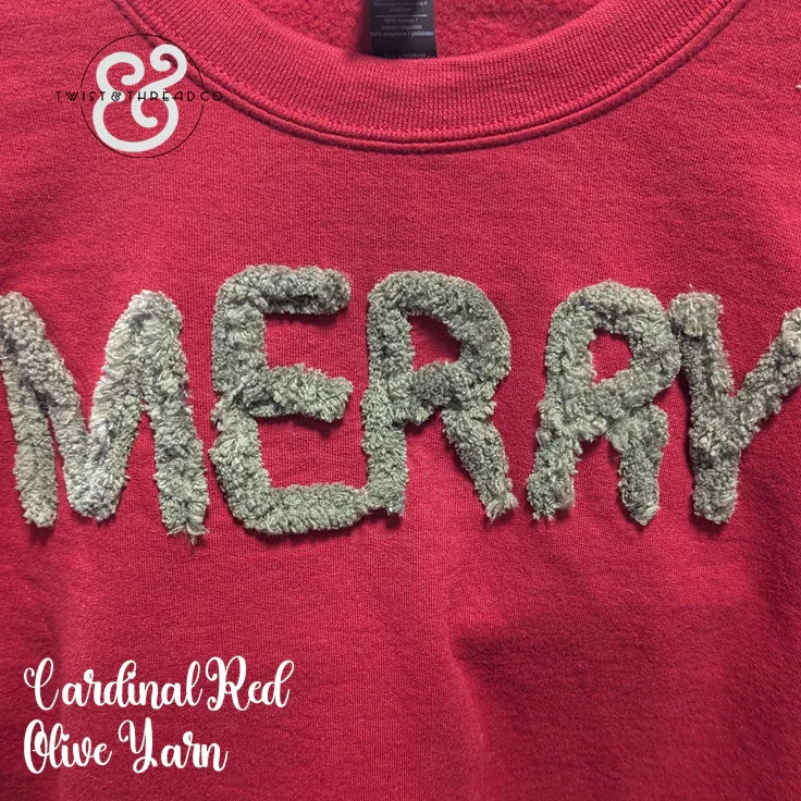 Red sweatshirt with 'MERRY' in textured olive yarn, festive holiday apparel
