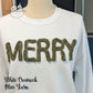 White crewneck sweatshirt with textured olive yarn MERRY letters on mannequin