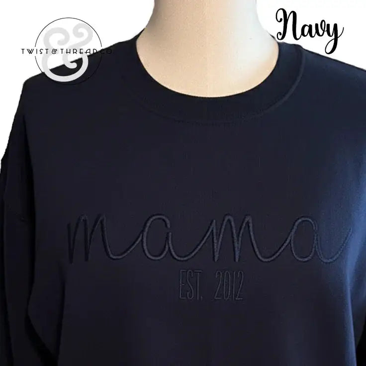 Navy blue sweatshirt with embossed "mama EST. 2012" text on front, casual mom apparel