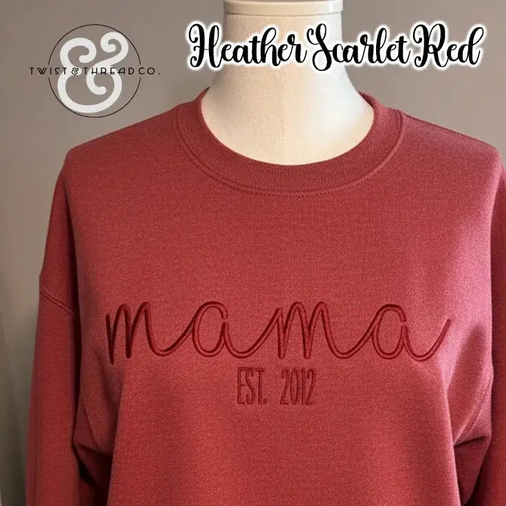 Heather scarlet red sweatshirt on mannequin with embroidered text 'mama Est. 2012' by Twist & Thread Co.