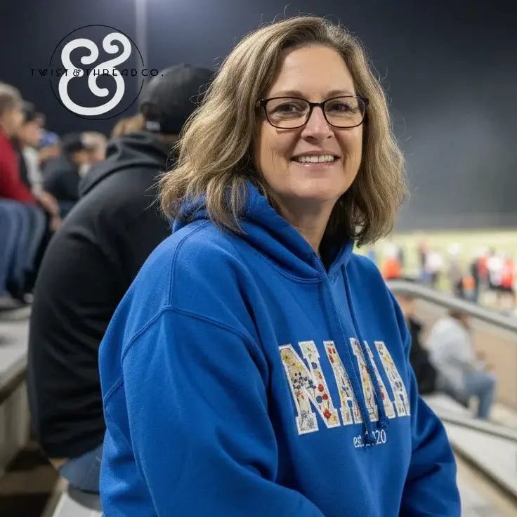 Blue hoodie with floral patterned letters spelling MAMA, women's casual apparel design