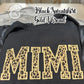 Black sweatshirt with the word MIMI embroidered in gold thread featuring leopard print applique design