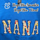 Royal blue sweatshirt with floral applique letters spelling NANA and est. 2020 embroidered