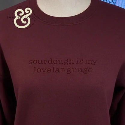 Maroon sweatshirt with text 'sourdough is my lovelanguage' and Twist & Thread Co logo