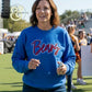 Woman wearing blue Bears embroidered sweatshirt at outdoor event, Twist & Thread Co.
