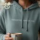 Custom embroidered hoodie with 'tomorrow needs you' text, Twist & Thread Co. branding, coffee mug