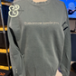 Twist & Thread Co. custom embroidered sweatshirt with 'Tomorrow needs you' text on front