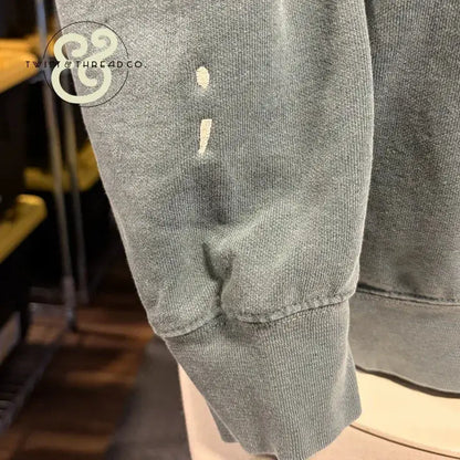 Custom embroidered sage green hoodie sleeve with semicolon design by Twist & Thread Co.