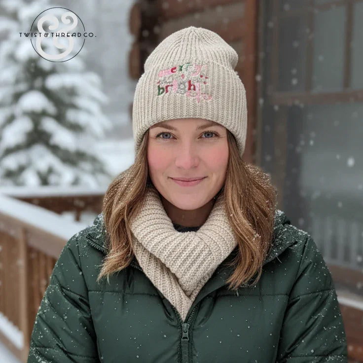 Woman in a cream knit beanie and scarf, green winter jacket, snowy outdoor cabin scene